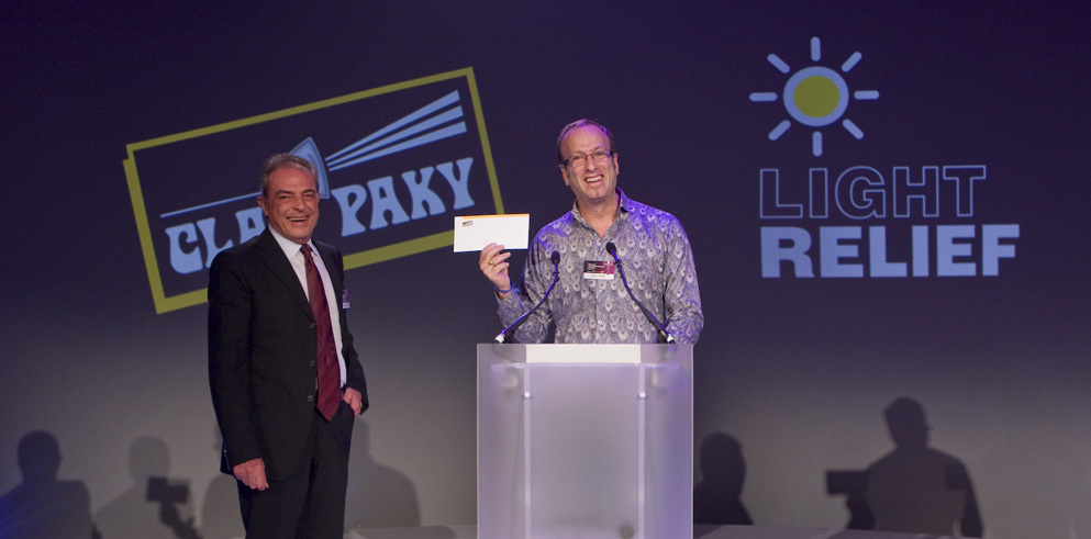 Clay Paky’s President Presents Light Relief Charity with Meaty Cheque at KOI Awards