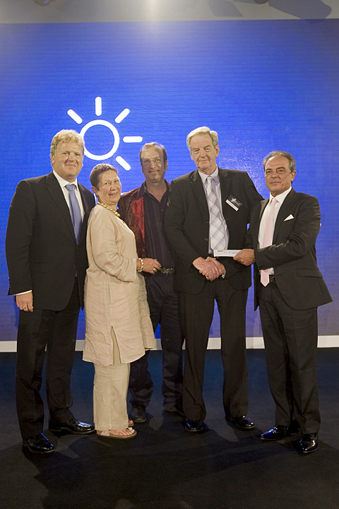 Pasquale Quadri, president of Clay Paky, put the cheque into the hands of Matthew Griffiths, John Simpson, Rick Fisher and Lesley Harmer, the trustees of Light Relief