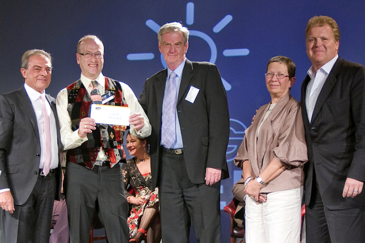 Rick Fisher receives the cheque for Light Relief from Pasquale Quadri (President of Clay Paky)